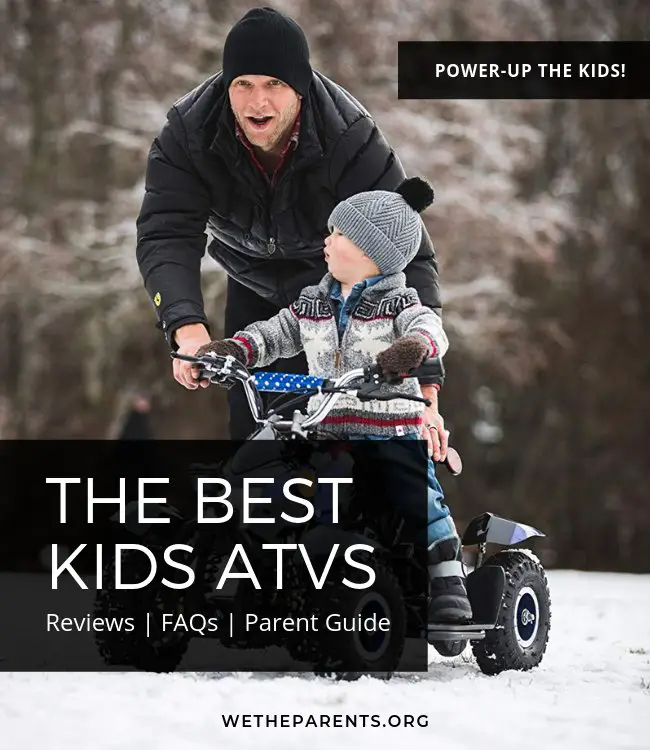 Father and son playing on a mini atv together in the snow