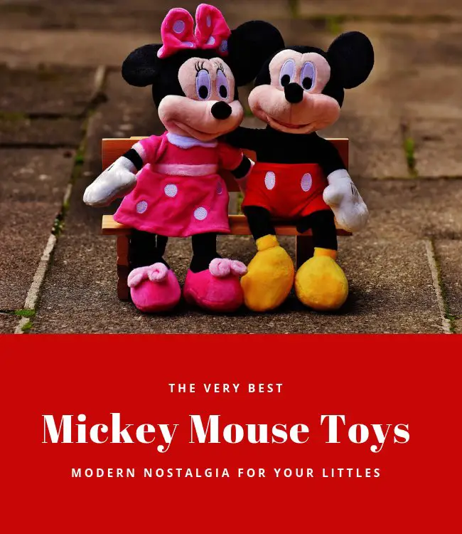 Mickey and mini mouse soft toys sitting next to each other on a bench
