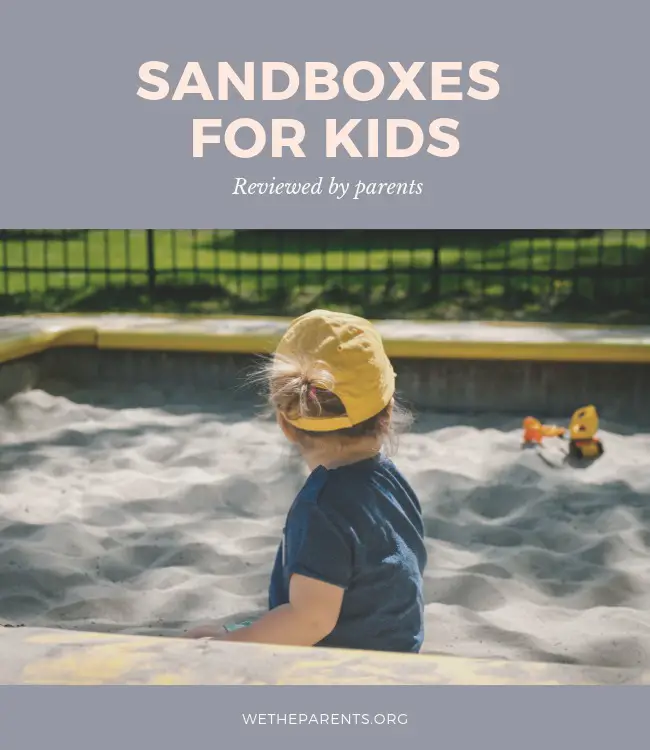 Child sitting in a sand box