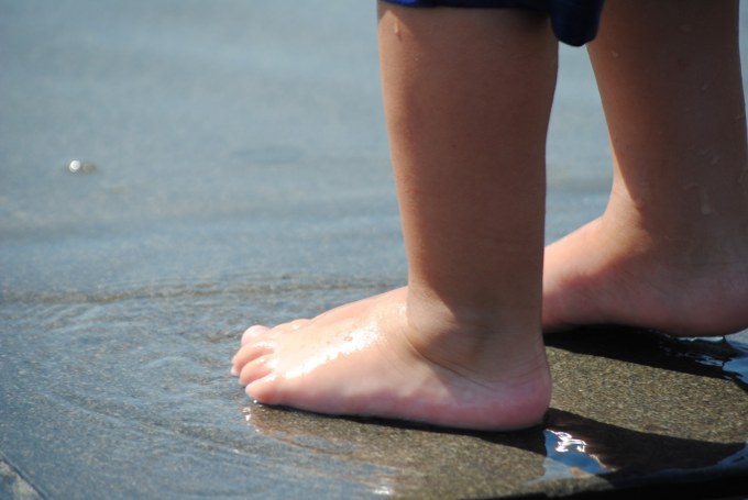 Child stands in water